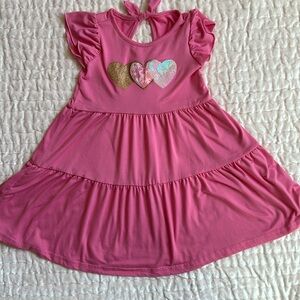 Cute little girls dress with 3 harts very good condition.